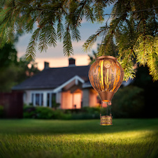 Solární svítidlo, kov hnědý mat, kov černý mat, kov s dekorativním děrováním měděné barvy, vypínač, ohnivý efekt, baterie AA 300mAh 3,7V, IP44, horkovzdušný balón, ø:14cm, V:46cm, včetně 12xLED 0,024W 3V 1800K